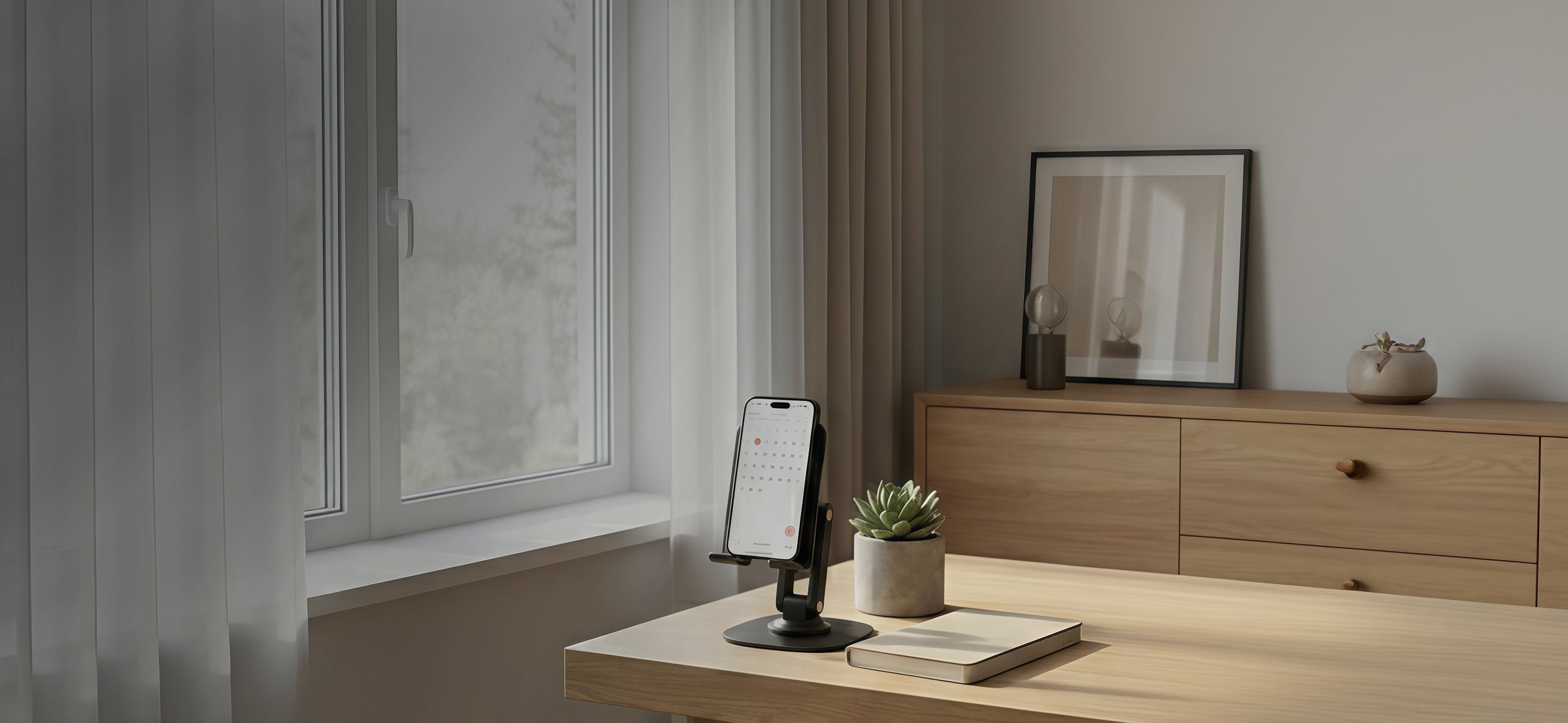 Smartphone on a minimalist stand in a clean workspace with natural light and modern decor