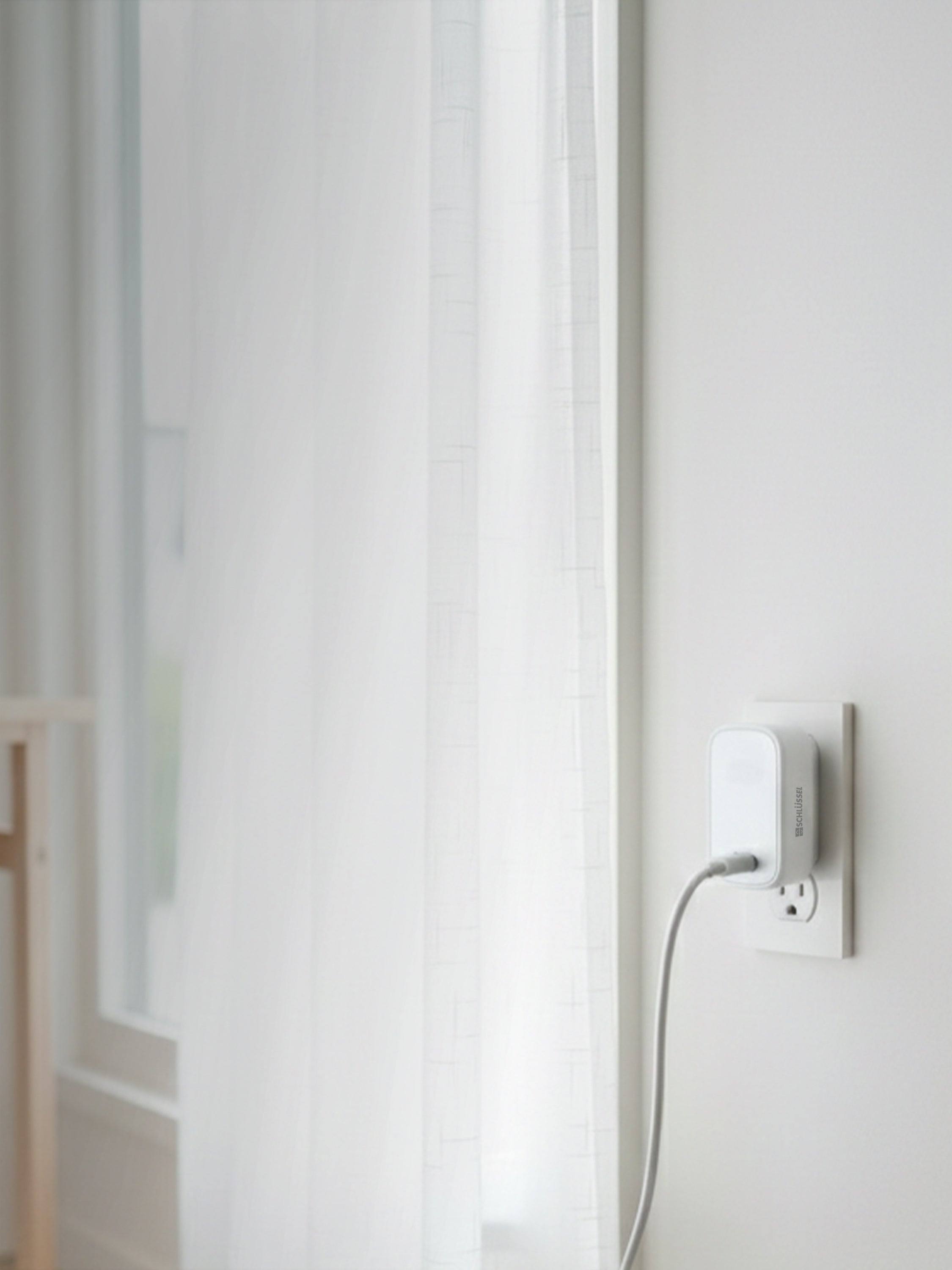 Schlüssel wall charger in a bright minimalist interior with soft natural light